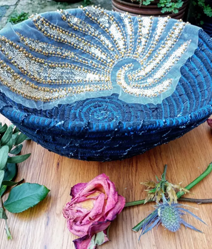 Sequinned denim rope bowl with a swirling wave design