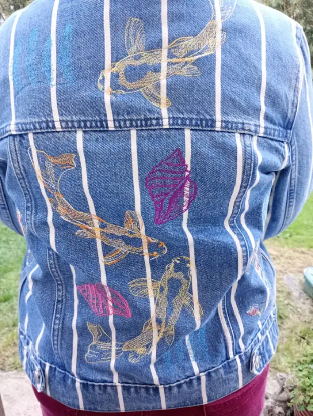 Striped denim jacket embroidered with koi fish