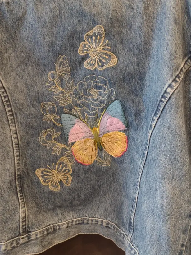 Denim jacket embroidered with golden butterflies and roses